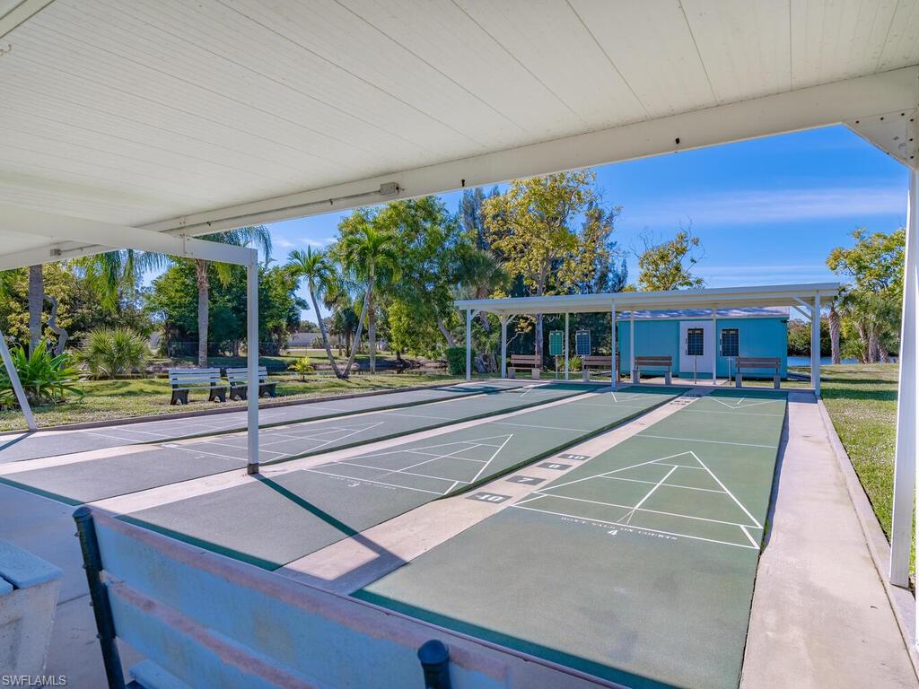 250 Indian Key Lane Naples, FL 34114 - Photo 30 of 33 a view of a building with a swimming pool