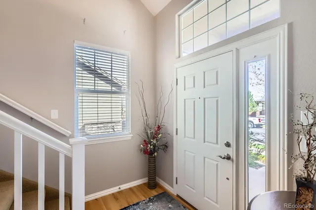 a view of a livingroom with wooden floor and a window