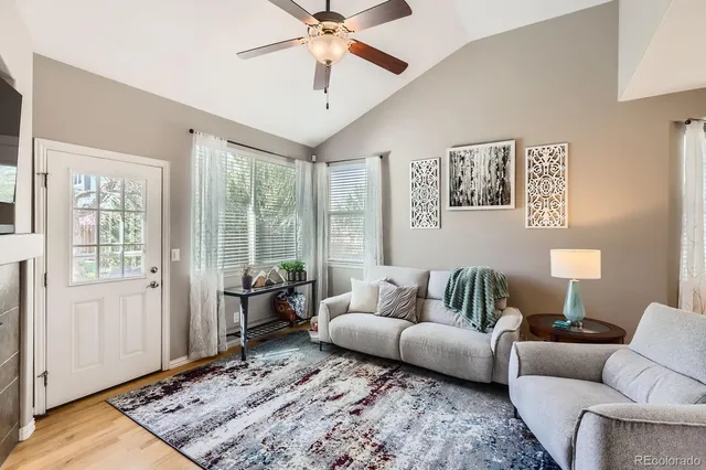 a living room with furniture and a rug