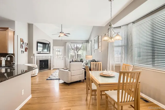 a living room with fireplace furniture and a flat screen tv