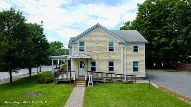 a front view of a house with a yard