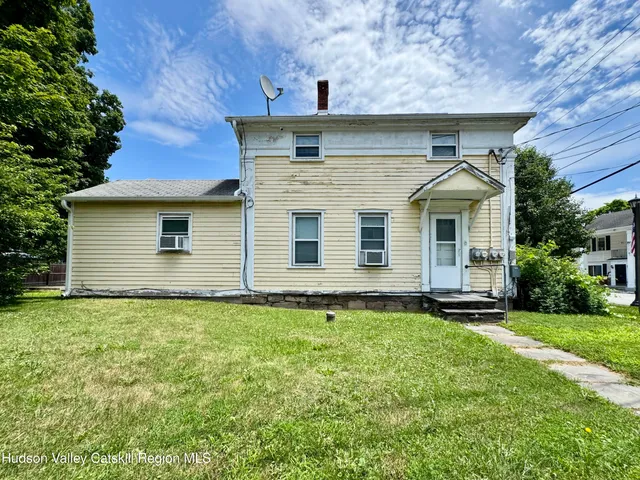 a room with furniture pool table and flat screen tv