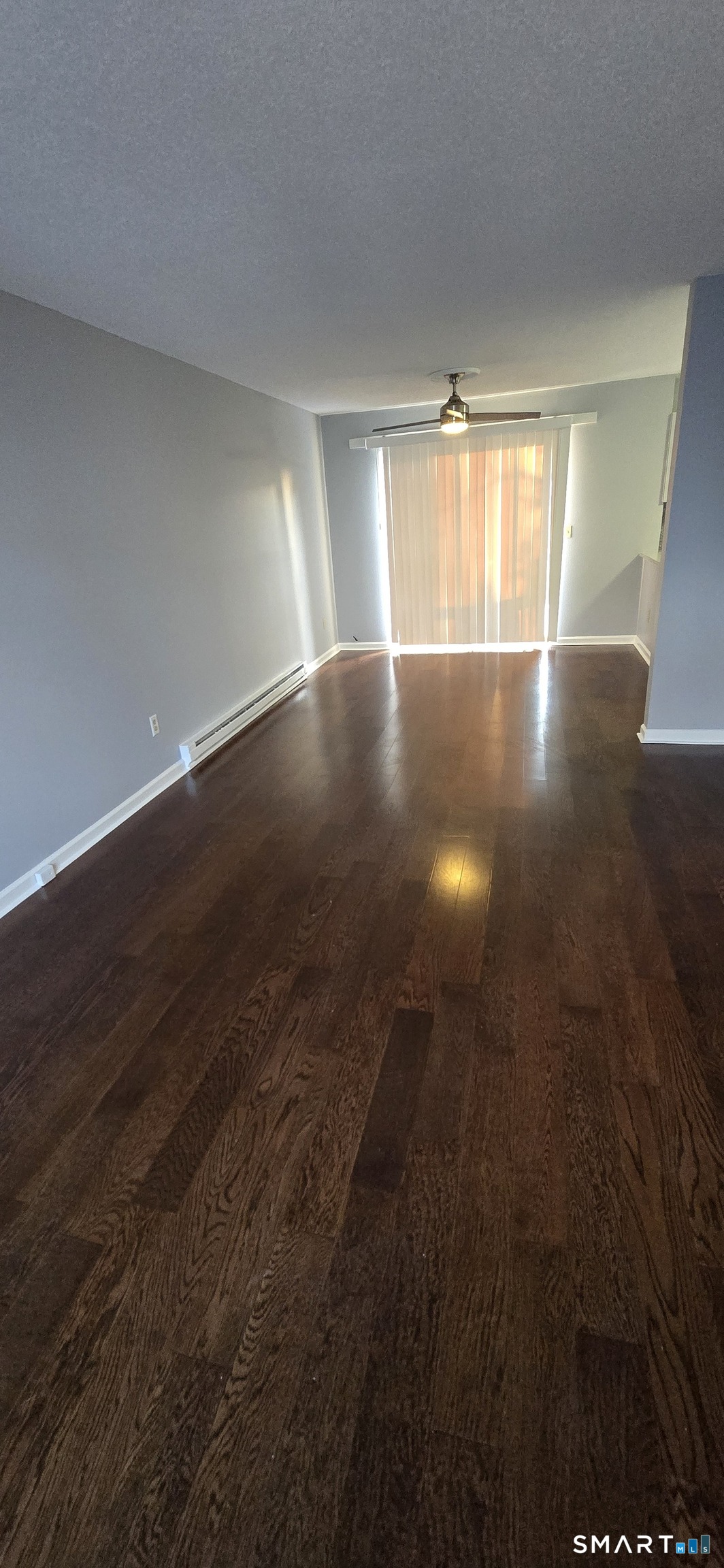 925 Oronoke Road, Unit 12C Waterbury, CT 06708 - Photo 14 of 20 an empty room with wooden floor and windows