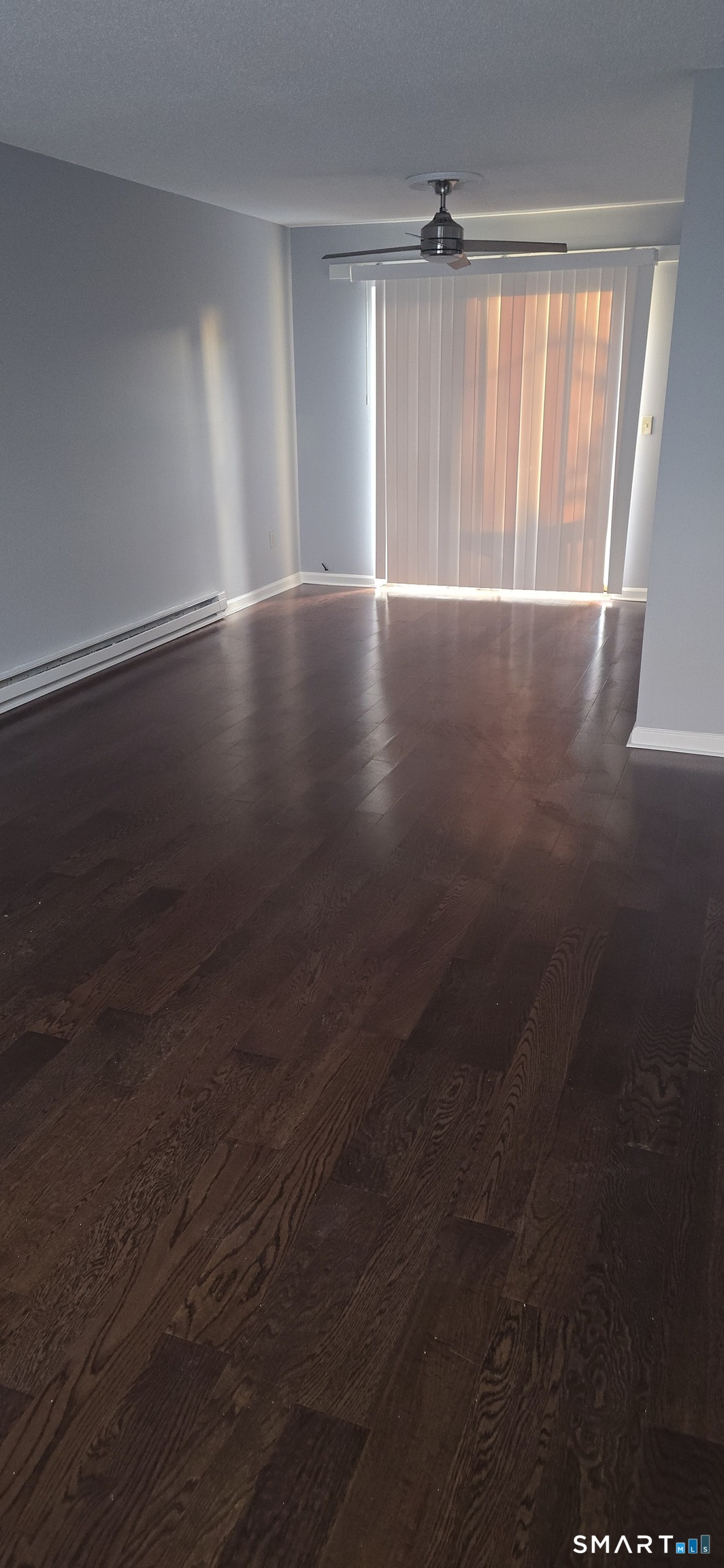 925 Oronoke Road, Unit 12C Waterbury, CT 06708 - Photo 19 of 20 an empty room with wooden floor and windows