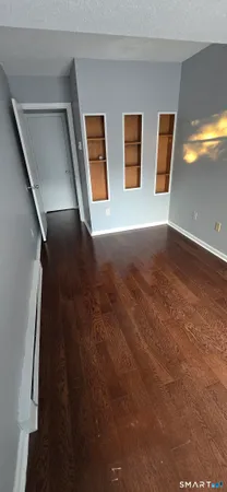 a room with a couch and windows