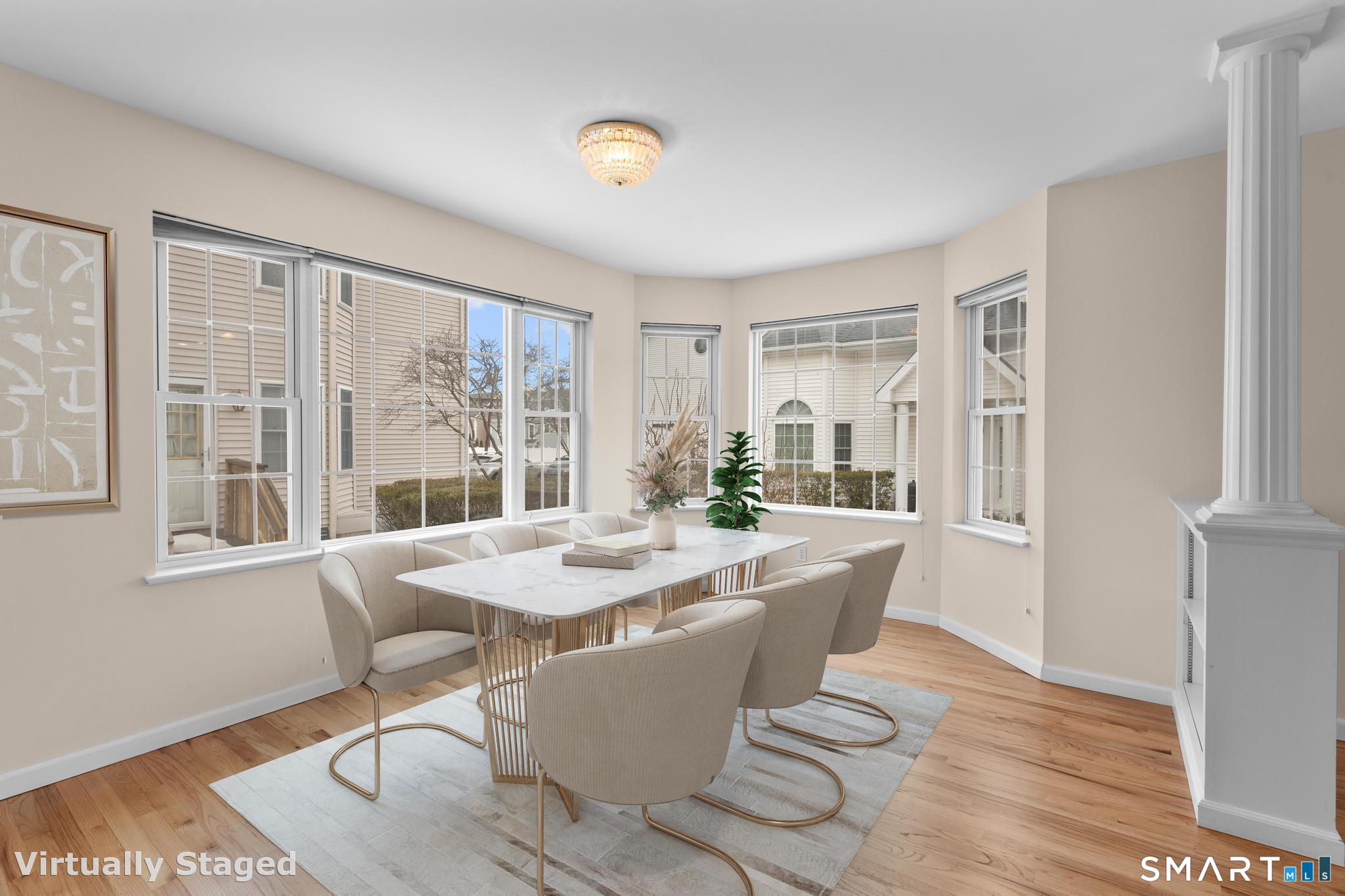 168 Colonial Road, Unit 6 Stamford, CT 06906 - Photo 13 of 41 a dining room with wooden floor and large window