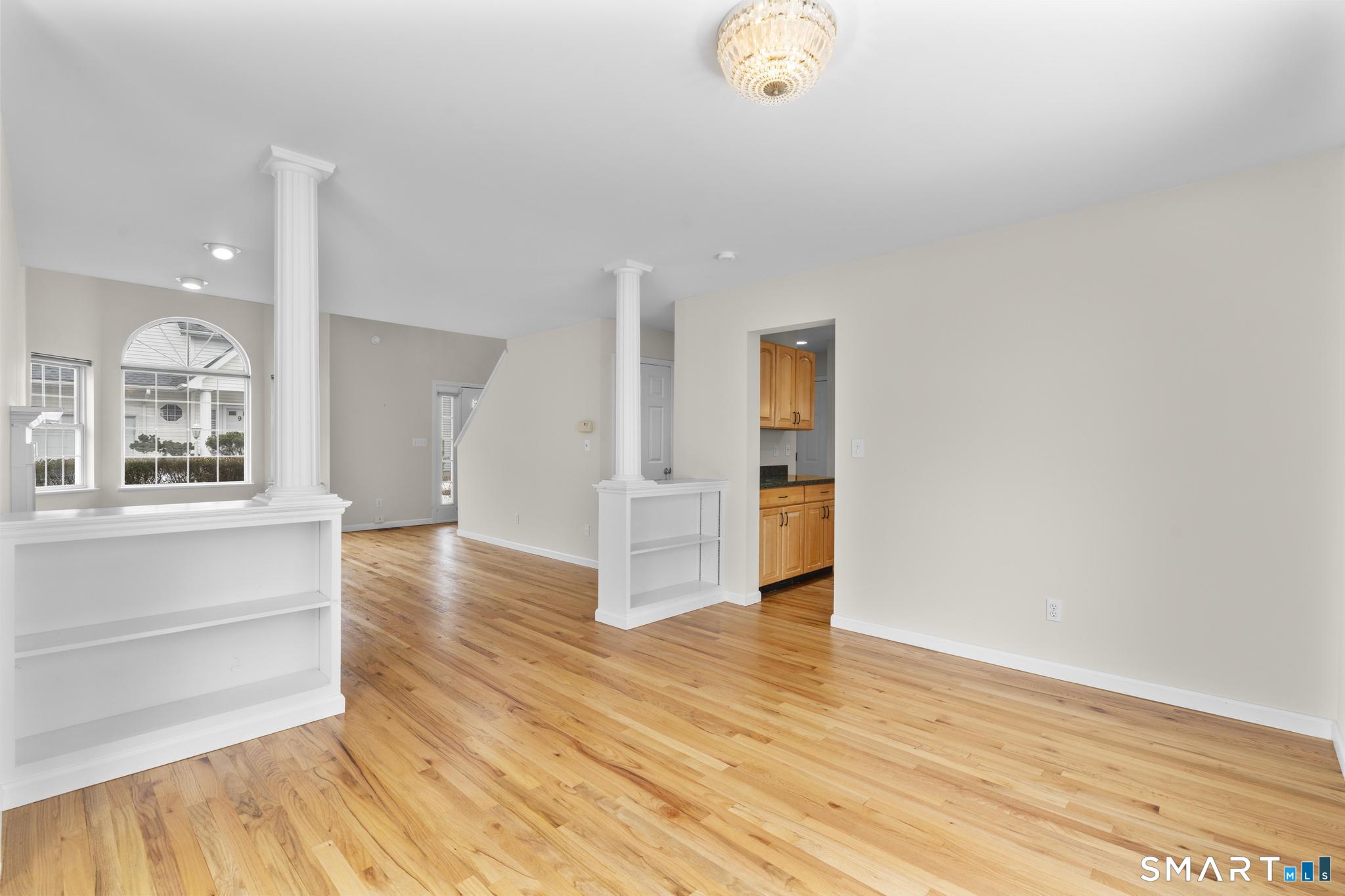 168 Colonial Road, Unit 6 Stamford, CT 06906 - Photo 17 of 41 a view of an empty room and wooden floor