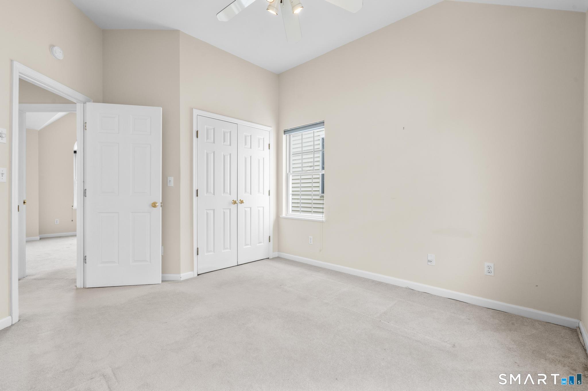 168 Colonial Road, Unit 6 Stamford, CT 06906 - Photo 36 of 41 an empty room with windows and closet