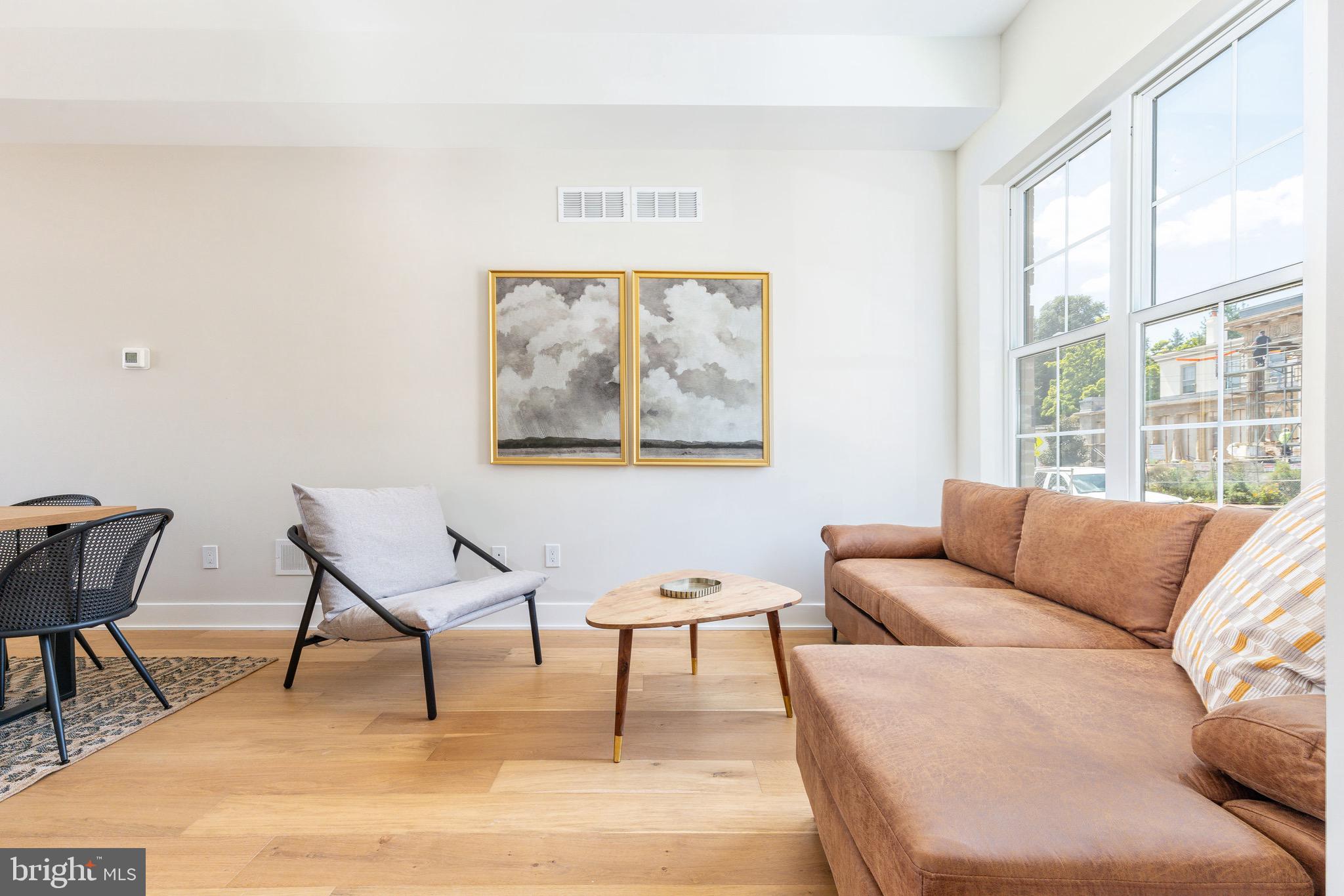 3845 Ridge Avenue Philadelphia, PA 19132 - Photo 1 of 31 a living room with furniture and a large window