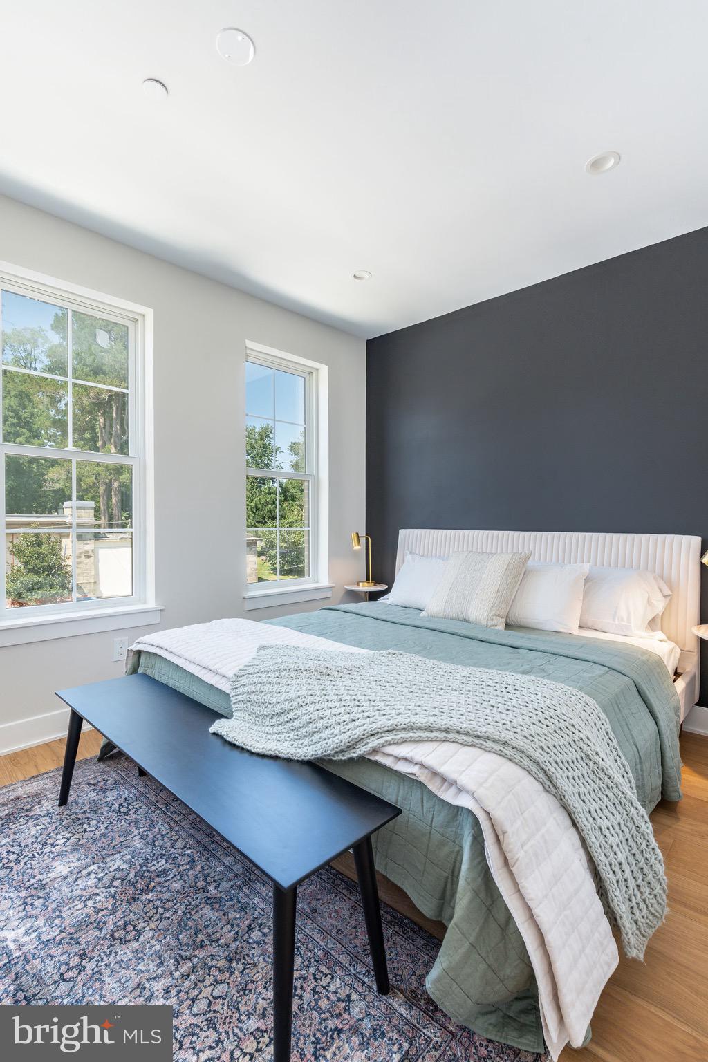 3845 Ridge Avenue Philadelphia, PA 19132 - Photo 11 of 31 a bedroom with a bed a table and windows