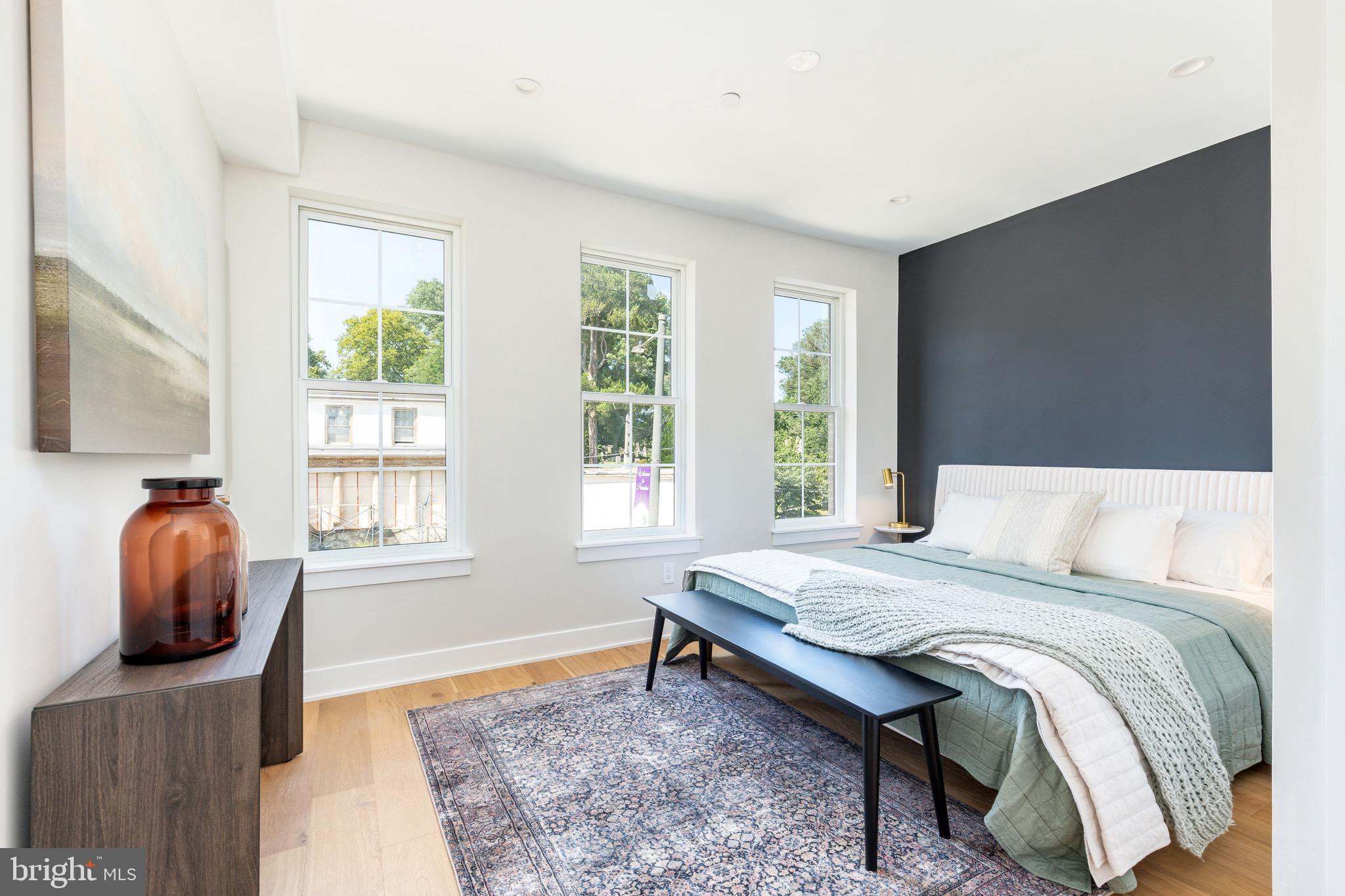 3845 Ridge Avenue Philadelphia, PA 19132 - Photo 12 of 31 a bedroom with a bed and a chair next to a window