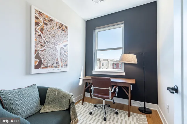 a workspace with furniture and a window