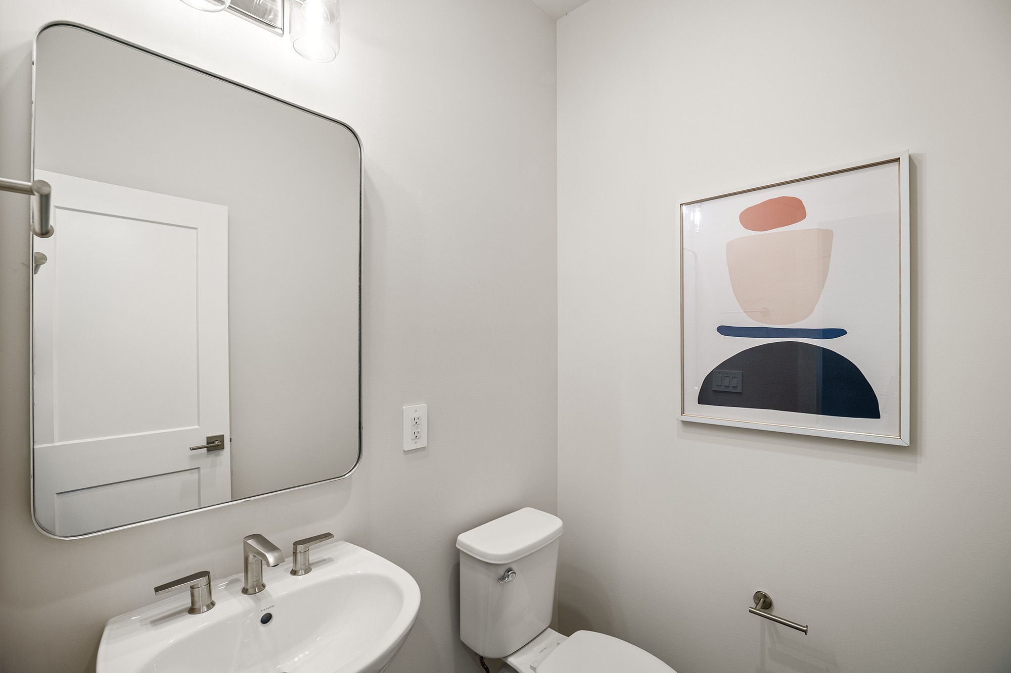 2615 Wilkinson Pike, Unit 1402 Murfreesboro, TN 37129 - Photo 9 of 43 a bathroom with a toilet sink and mirror