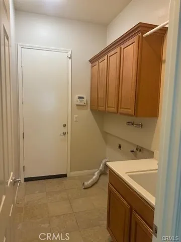 a bathroom with a sink and a washing machine