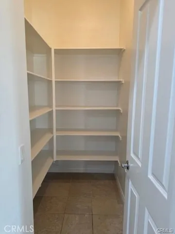 a storage room with a wooden floor