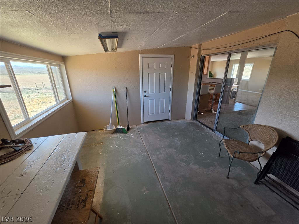 2930 Frehner Ranch Road Pioche, NV 89043 - Photo 25 of 39 A spacious sunroom with large windows offers peaceful views of the expansive rural landscape.