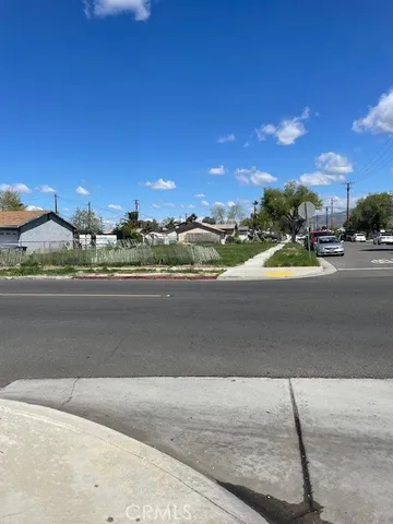 a view of a street with a building in the background