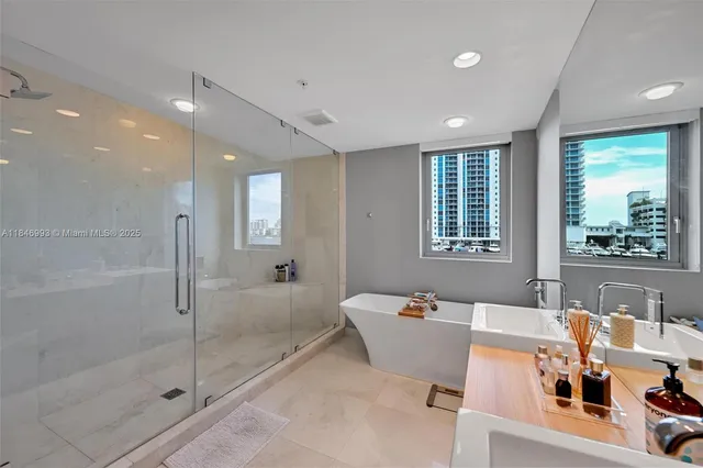 a very nice looking room with a large window and chandelier