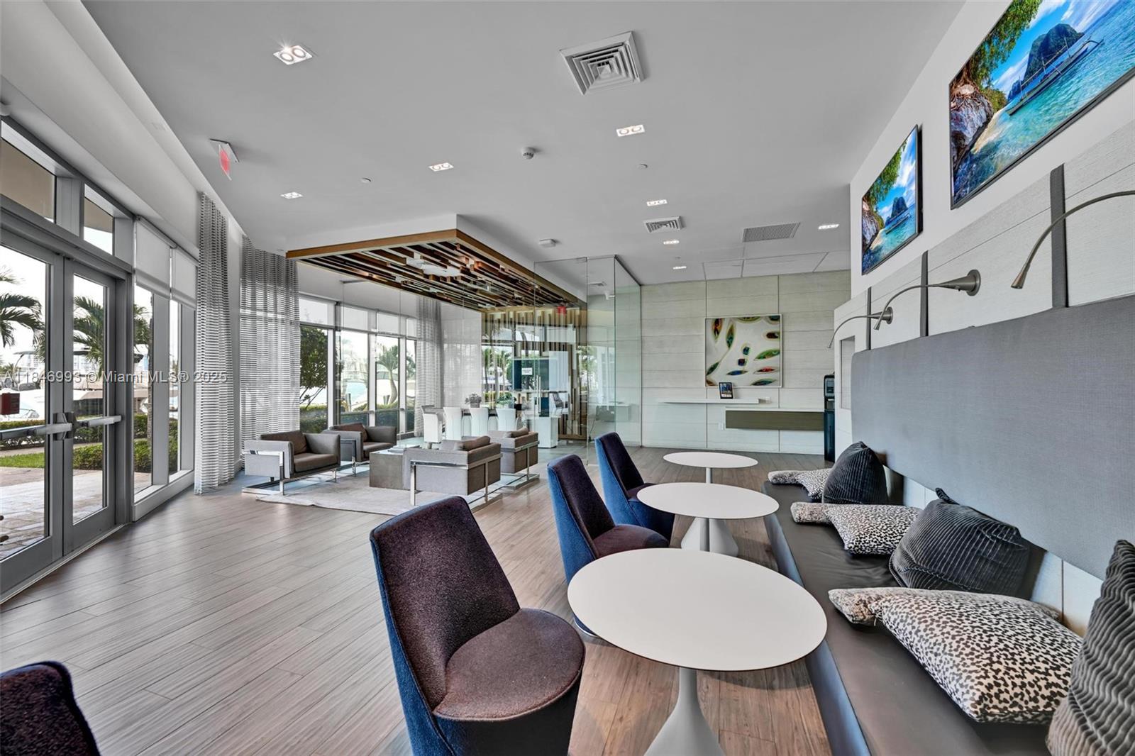 17111 Biscayne Boulevard, Unit 207 North Miami Beach, FL 33160 - Photo 28 of 54 a living room with furniture and a large window
