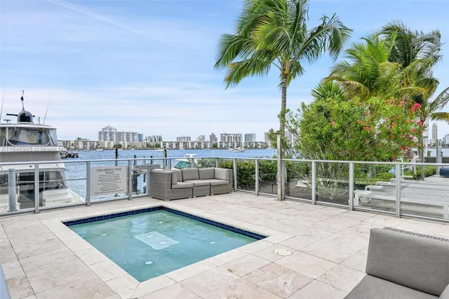 a view of a swimming pool with a lounge chair