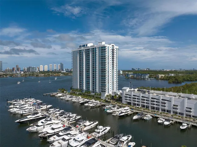 a view of a lake with tall buildings