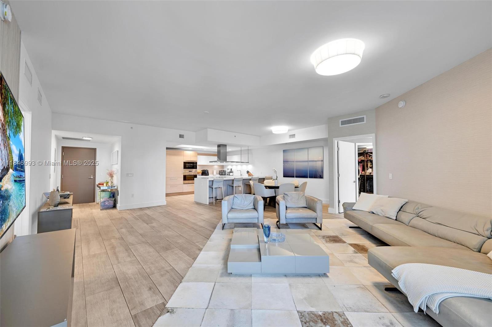 17111 Biscayne Boulevard, Unit 207 North Miami Beach, FL 33160 - Photo 5 of 54 a living room with furniture and a couch