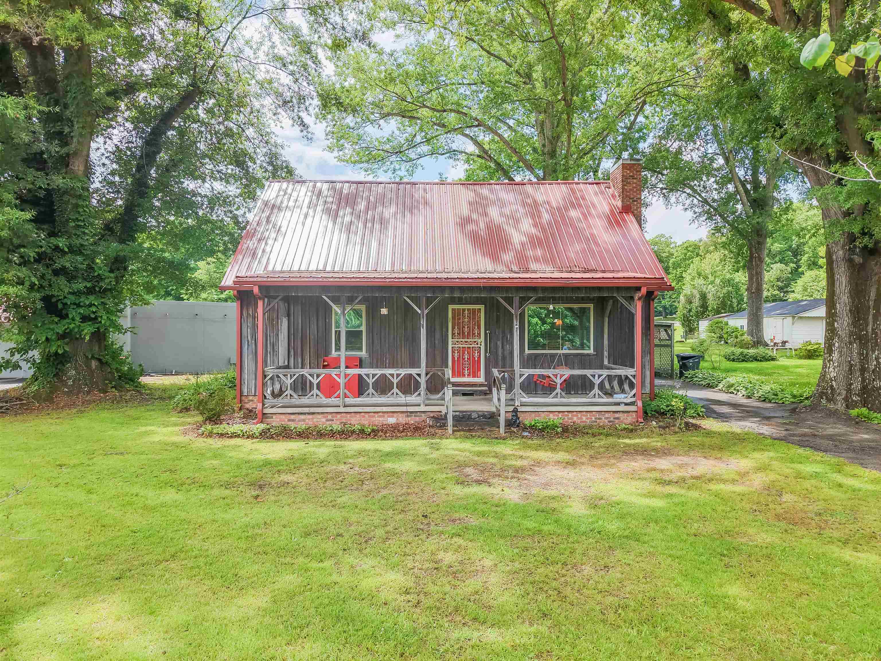 12 Baker Road Selmer, TN 38375 - Photo 3 of 28 a view of a house with swimming pool and sitting area