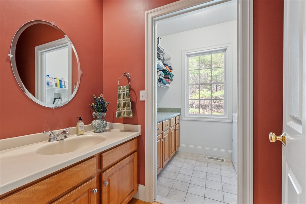 18 Danforth Lane Bolton, MA 01740 - Photo 14 of 29 a bathroom with a sink a vanity and a mirror