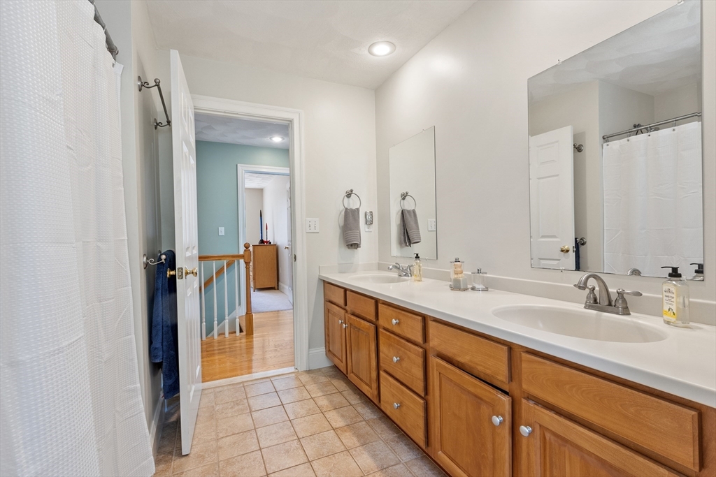 18 Danforth Lane Bolton, MA 01740 - Photo 22 of 29 a spacious bathroom with a double vanity sink and a mirror