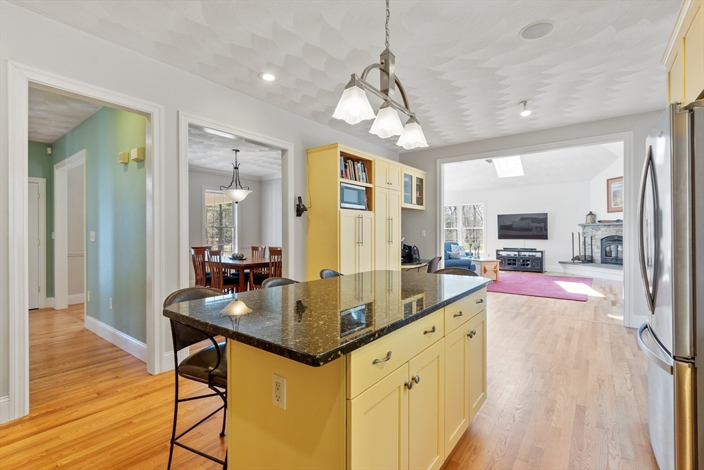 18 Danforth Lane Bolton, MA 01740 - Photo 6 of 29 a large kitchen with kitchen island a large island in the center
