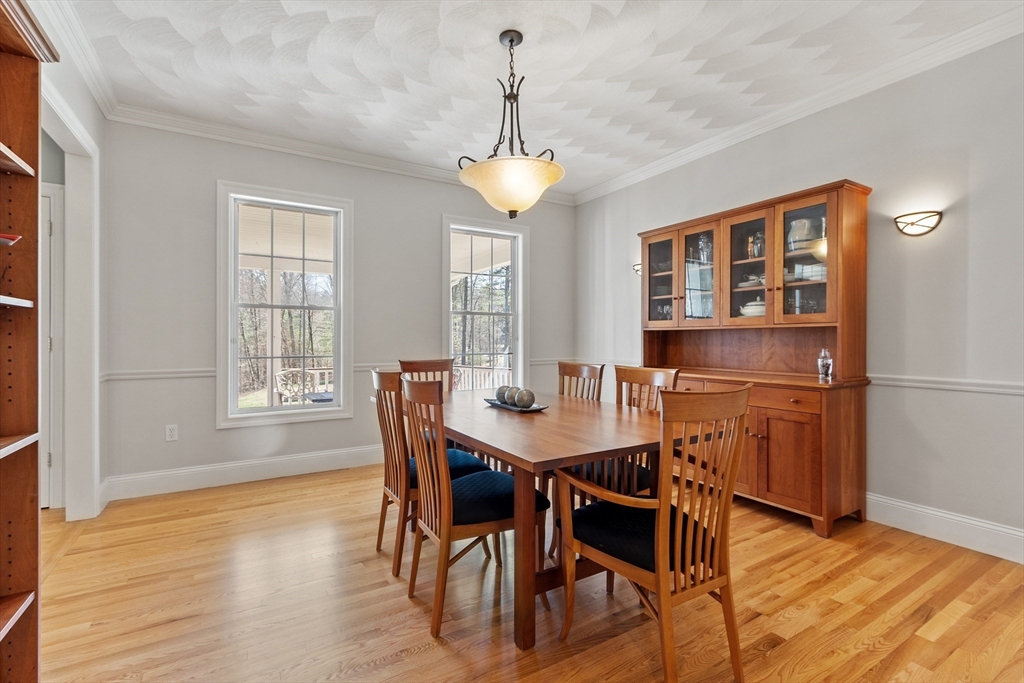 18 Danforth Lane Bolton, MA 01740 - Photo 10 of 29 a view of a dining room with furniture window and wooden floor