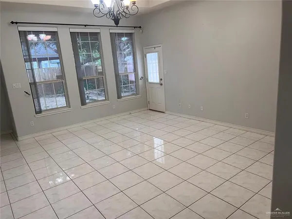 a view of an empty room with windows