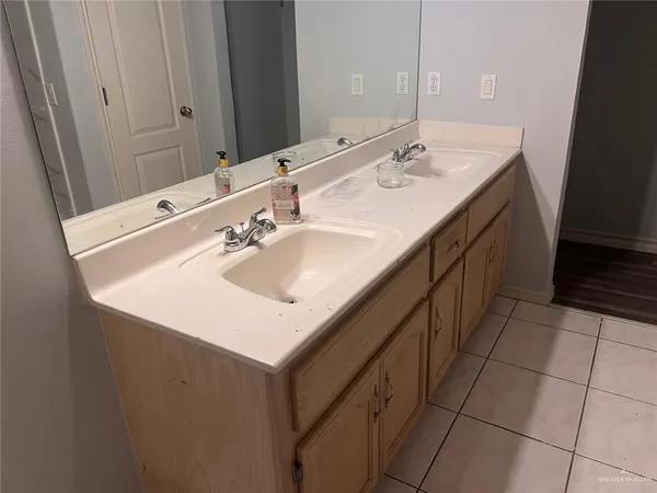a bathroom with a sink and a mirror