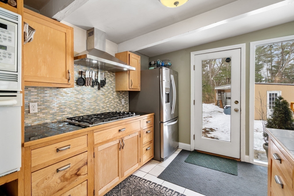 56 Millbrook Road Medfield, MA 02052 - Photo 11 of 28 a kitchen with stainless steel appliances granite countertop a refrigerator and a stove