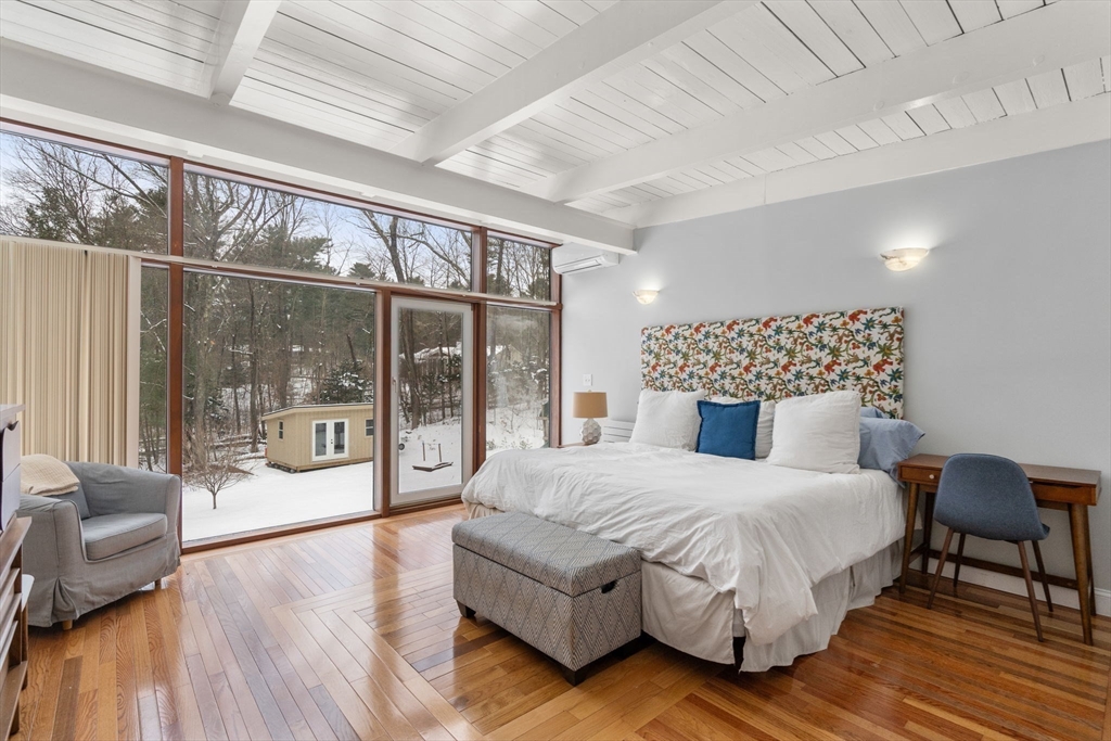 56 Millbrook Road Medfield, MA 02052 - Photo 14 of 28 a bedroom with a large bed and a large window with outer view