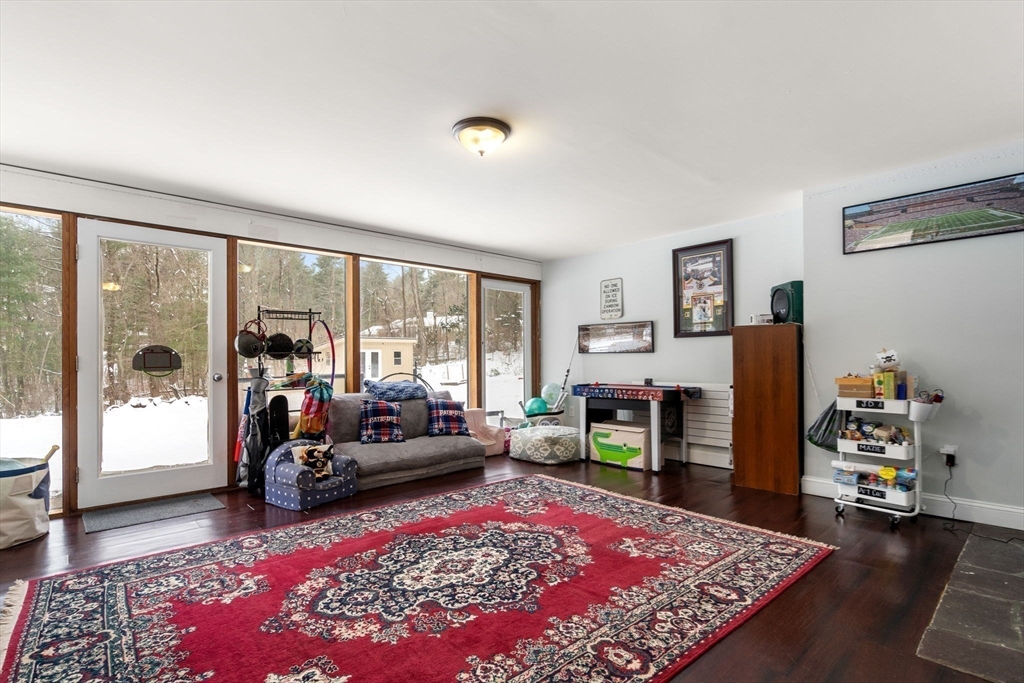 56 Millbrook Road Medfield, MA 02052 - Photo 21 of 28 a living room with furniture rug and a table