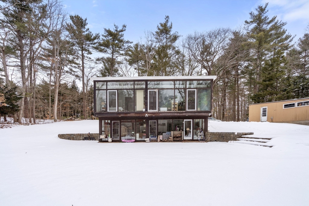 56 Millbrook Road Medfield, MA 02052 - Photo 27 of 28 a view of a house with a yard covered in snow