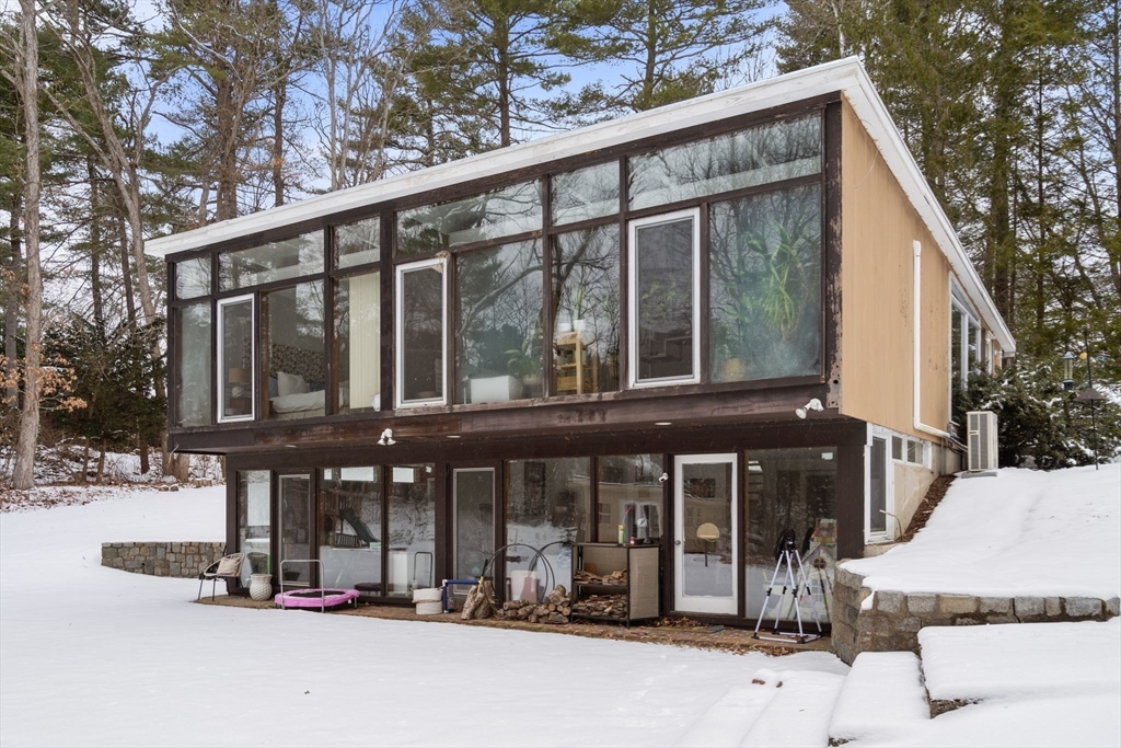 56 Millbrook Road Medfield, MA 02052 - Photo 3 of 28 a view of a chairs and table in the patio