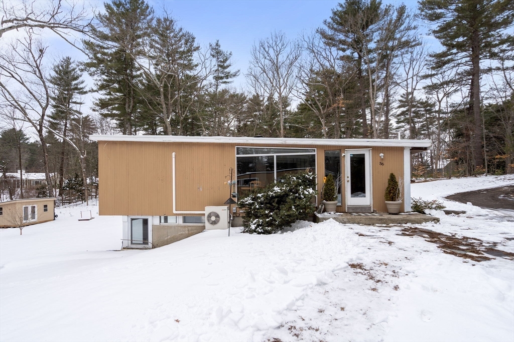 56 Millbrook Road Medfield, MA 02052 - Photo 4 of 28 a view of a house with snow in front of house