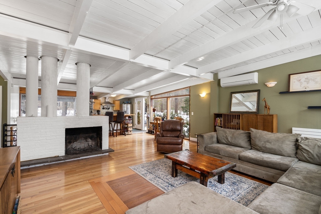 56 Millbrook Road Medfield, MA 02052 - Photo 6 of 28 a living room with furniture fireplace and a table