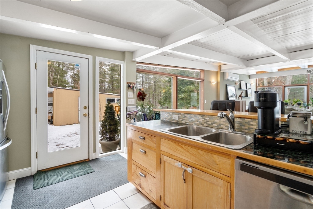56 Millbrook Road Medfield, MA 02052 - Photo 10 of 28 a kitchen with sink and refrigerator