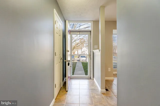 a bathroom with a glass door shower and a sink