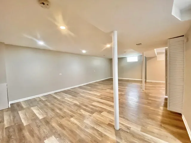 a view of a room with wooden floor