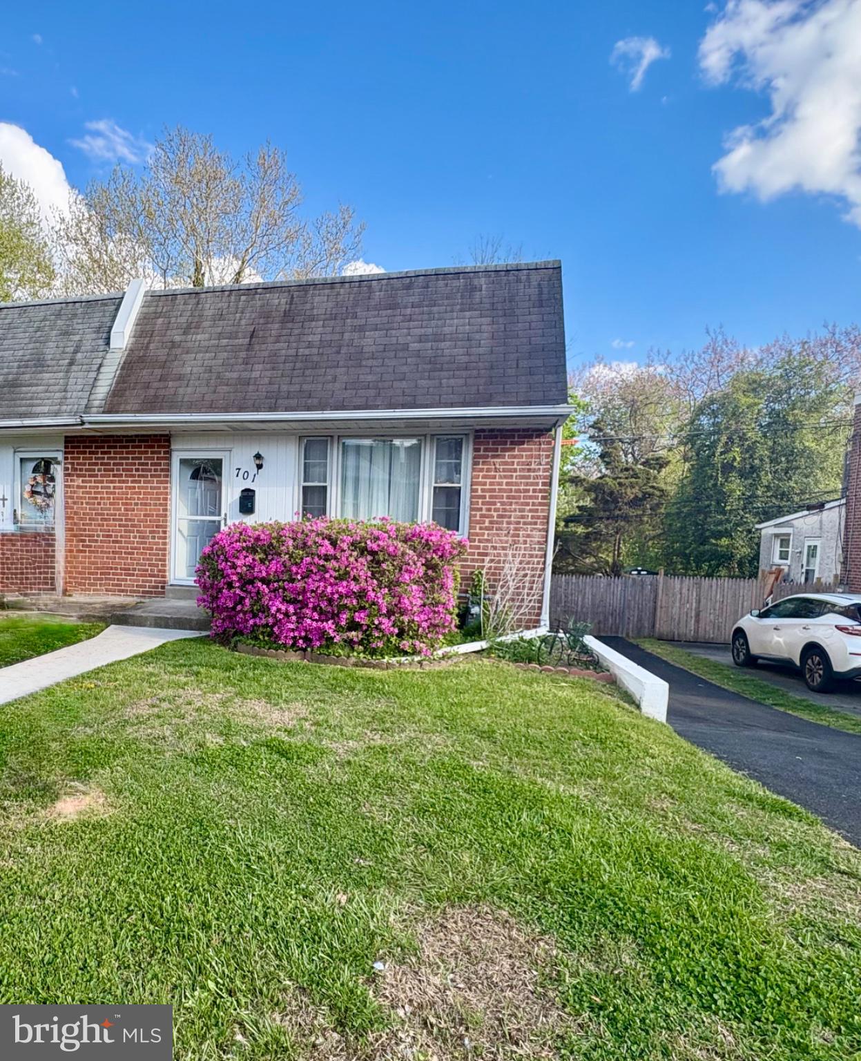 Charming home with vibrant blooms.