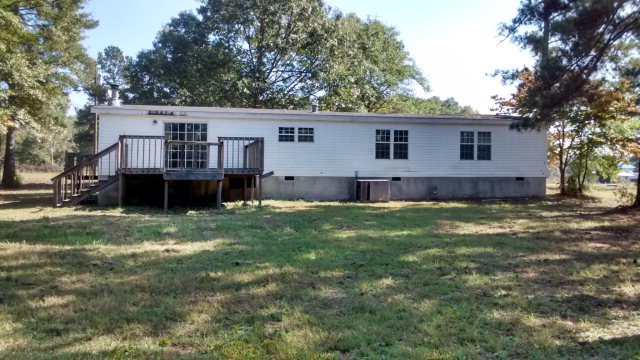 106 Lovett's Ridge Jackson, GA 30233 - Photo 2 of 4 a view of a house with a yard