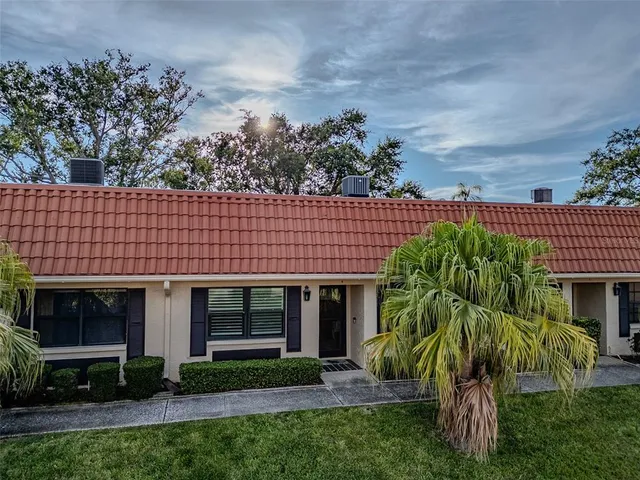 a view of a house with garden and plants