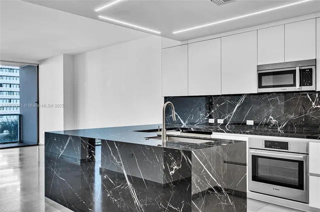 a kitchen with a stove and a microwave