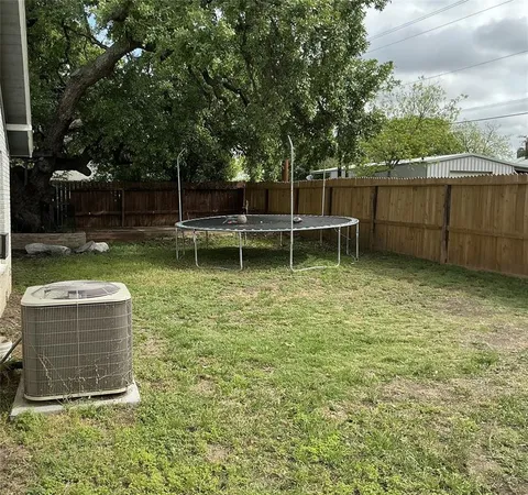 a backyard of a house with lots of green space
