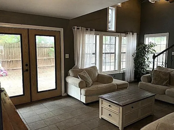 a living room with furniture and a window