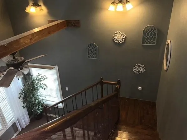 a view of balcony with furniture and wooden floor